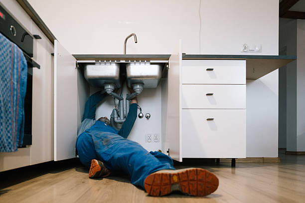 Professional Drain Cleaning technician working in Raynham Center, MA
